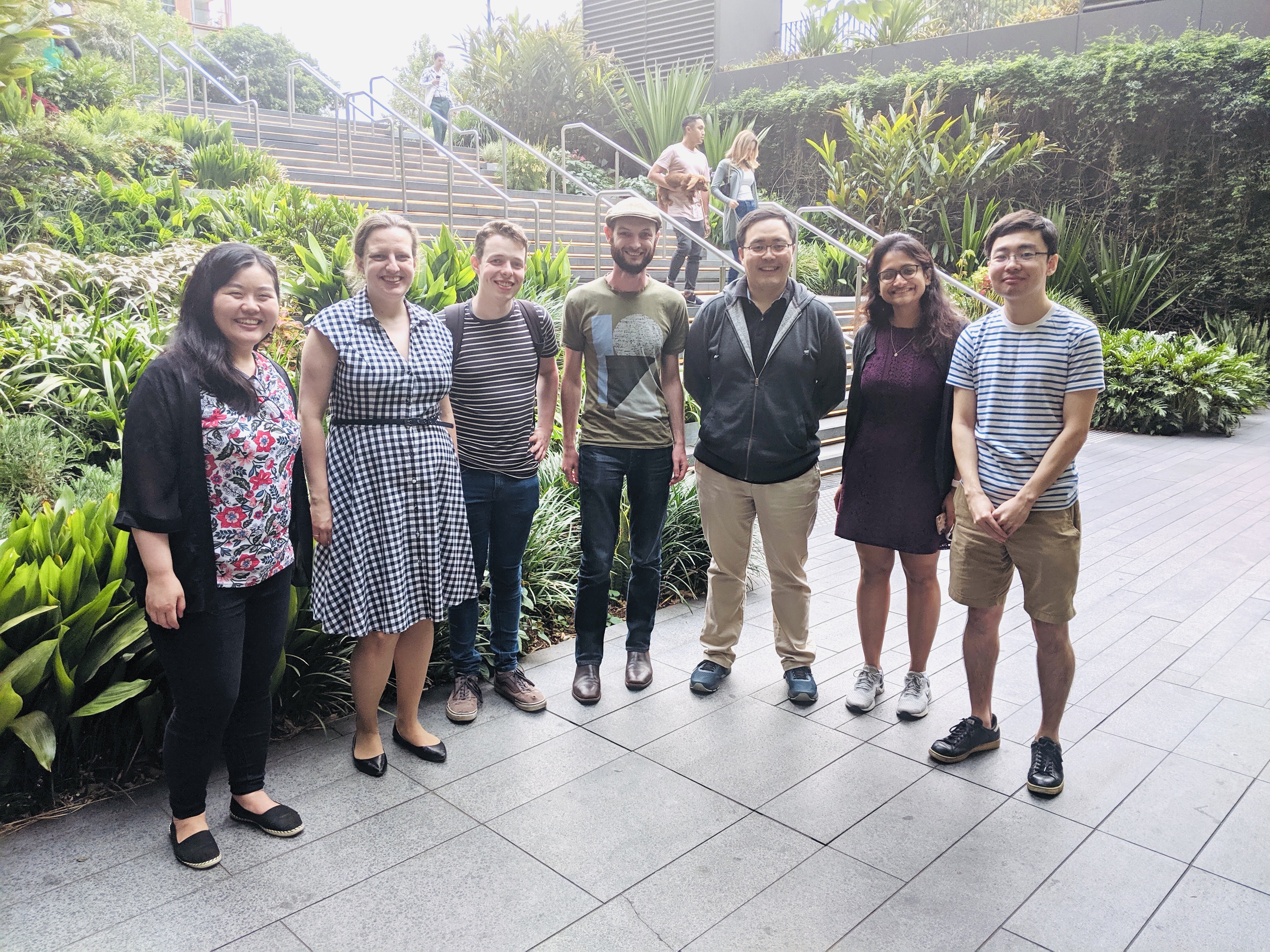 This photograph shows all the team members posing and smiling together.